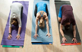 Yoga Class in Balasana (Child's Pose) on Yoga Towels