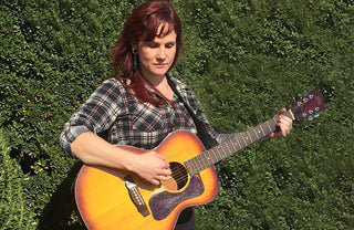 Woman Playing Guitar