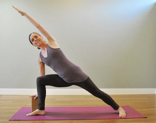 Parsvakonasana on Tapas® Ultra Mat - Burgundy with Cork Block