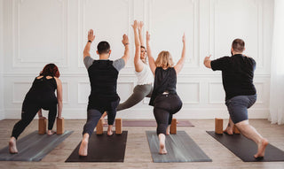 Class in High Lunge on Pacific Fog and Tapas® Black Mats