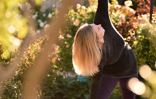 Woman Practicing Yoga Outside