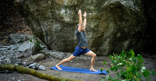 Man Outdoors in Warrior 1 Pose on Earth Elements Mat - Sky Blue