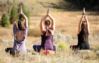 Women Sitting on Meditation Cushions