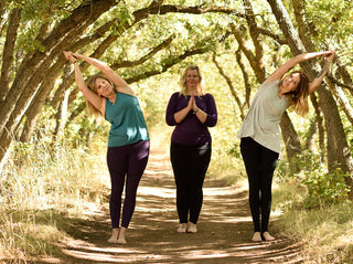 Women Standing in Tree Tunnel