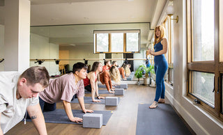 Teacher and Yoga Class