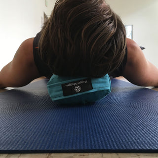 Person Reclining on Pranayama Yoga Bolster - Aqua