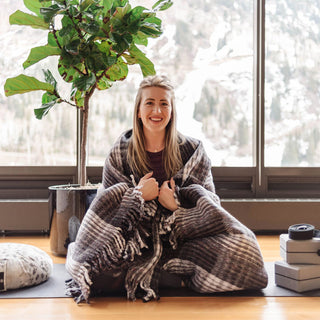 Woman wrapped in Recycled Plaid Yoga Blanket - Black