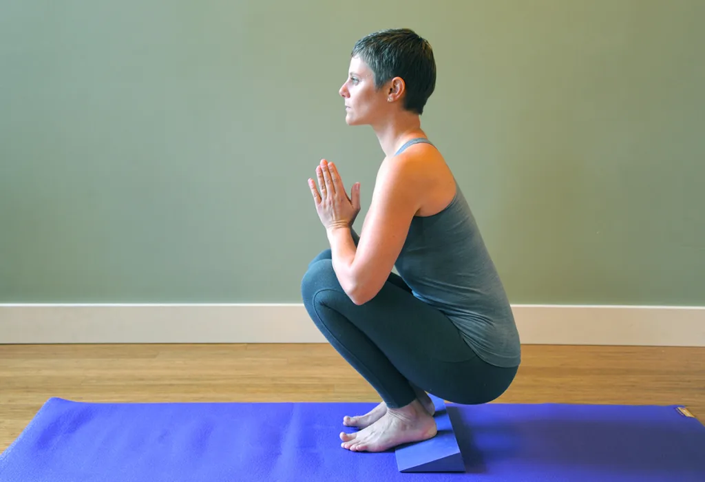 Malasana (Garland Pose) with Foam Yoga Wedge - Purple