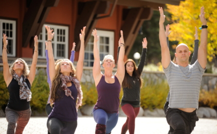 Class in Warrior 1 Pose