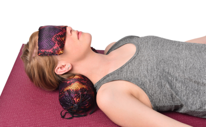 Woman Reclining with Silk Eye Pillow and Neck Pillow