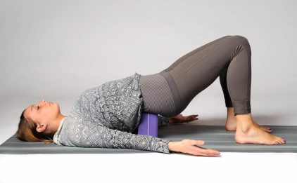 Supported Setu Bandha Sarvangasana (Bridge Pose) with Yoga Block