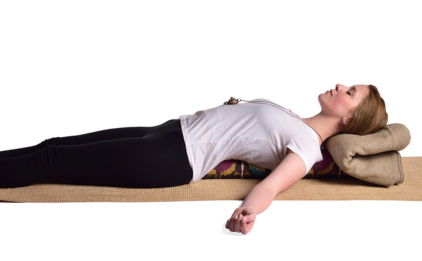 Woman Reclining on Pranayama Bolster - Bohemian Ikat