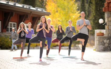 Yoga Class in Vrksasana (Tree Pose)