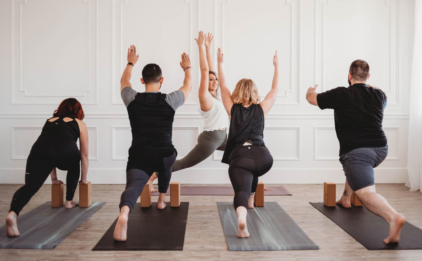 Class in High Lunge on Pacific Fog and Tapas® Black Mats