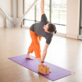 Parivrtta Trikonasana (Revolved Triangle Pose) with Bamboo Yoga Block