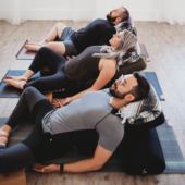 Supta Baddha Konasana with Mexican Blankets and Standard Bolsters - Gray, Burgundy, Purple