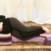 Pregnant Person with Pranayama Yoga Bolster Between Legs - Black