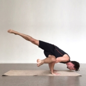 Flying Crow Pose on Sattva Jute Yoga Mat