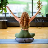 Woman Sitting on V-Shaped Meditation Cushion - Gray
