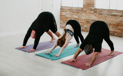 Yoga Class in Downward Facing Dog