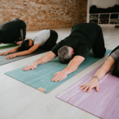 Child's Pose on Para Rubber Yoga Mats - River, Lotus