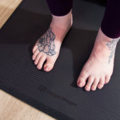 Feet on Ultimate Cushion Mat - Black