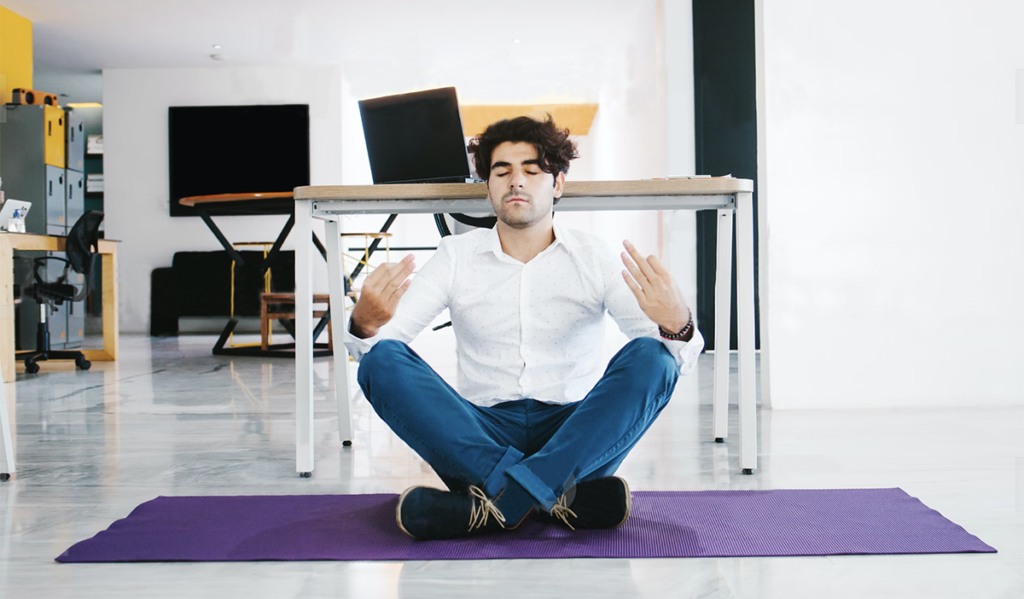 Man Meditating in Work Office
