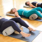 Yoga Class Reclining on EZ Clean Standard Bolster - Taupe, Cork Yoga Block, Cotton Blanket - Multi-Gray, Eye Pillow - Gold