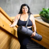 Woman Carrying Ultimate Cushion Mat with Strap Sling Yoga Mat Carrier - Charcoal