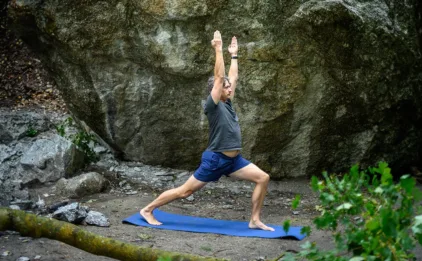 Man Outdoors in Warrior 1 Pose on Earth Elements Mat - Sky Blue